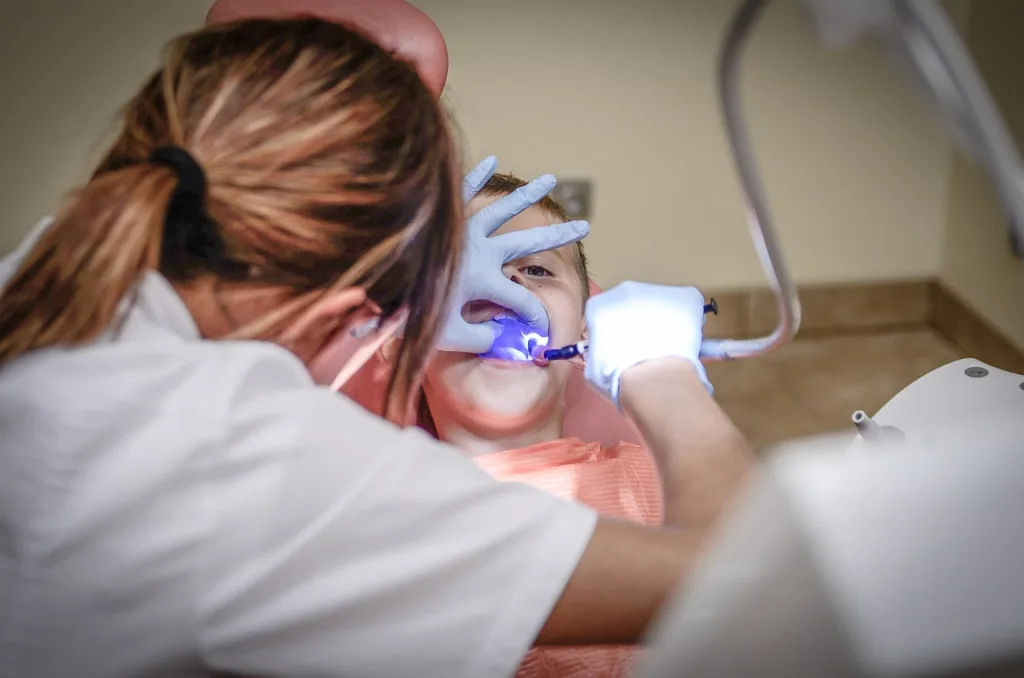 Photo of Dentist Drilling Tooth To Treat NFZ